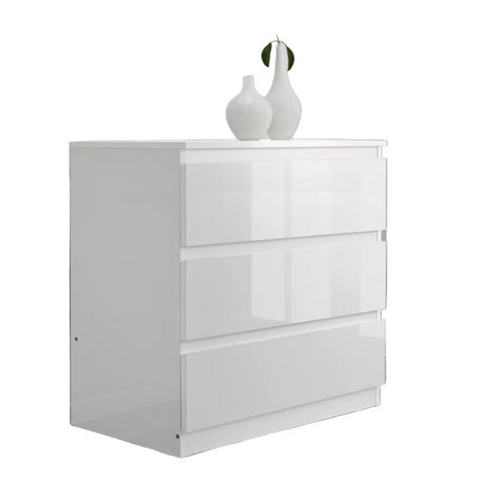 White dresser with three drawers on a white background