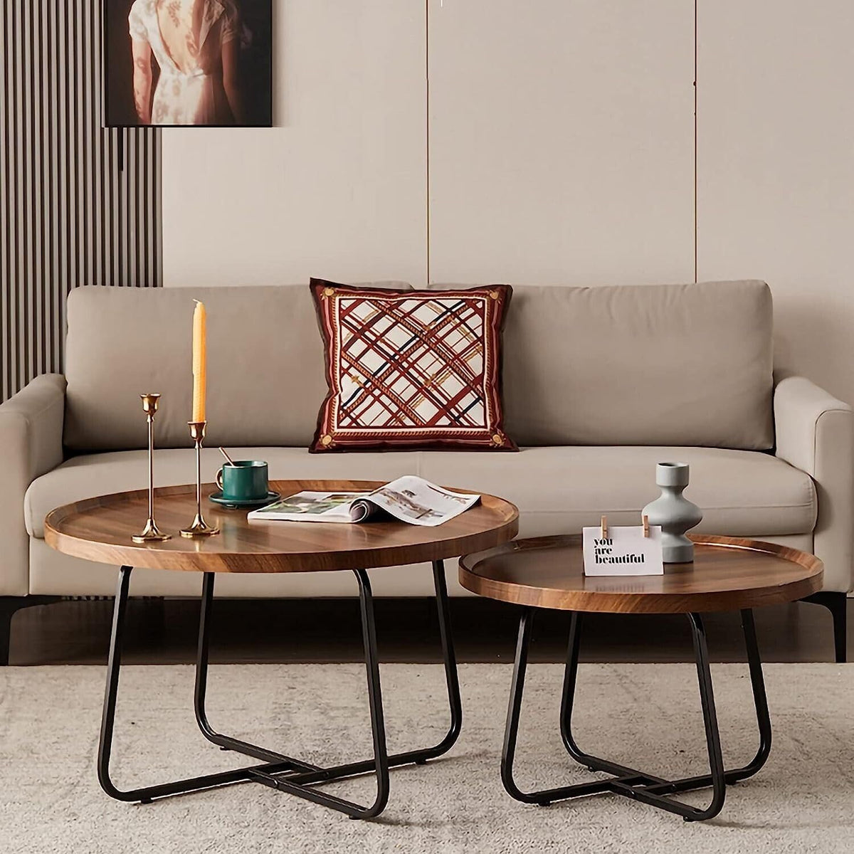 Living room with a beige sofa, wooden coffee table, and decorative items.